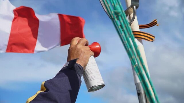 Hand air horn with sky background