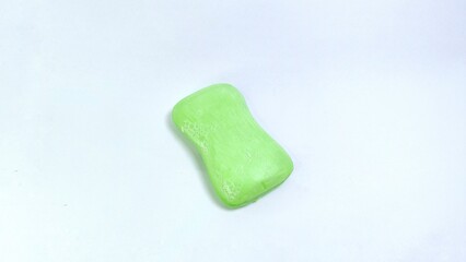 light green soap bubbles isolated on white background, bar soap with maca scent