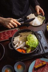 woman in a japanese hotpot restaurant
