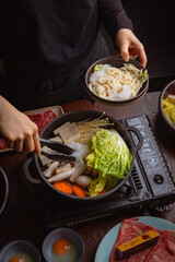 woman in a japanese hotpot restaurant
