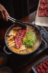 woman in a japanese hotpot restaurant