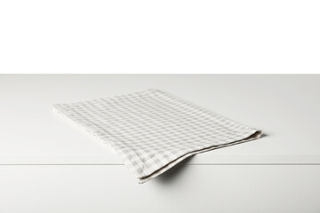 Checkered napkin on light table against white background