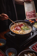 woman in a japanese hotpot restaurant