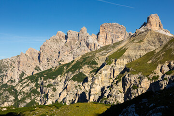 Hiking through Dolomite Mountains is surreal experience, surrounded by jagged peaks and serene landscapes.