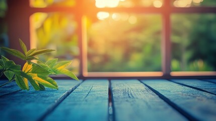 Green leaves rest on a rustic wooden table as warm sunlight streams through a window, creating a serene ambiance in the room