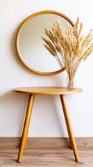 Minimalist hallway featu round wooden table, circular mirror, and dried wheat vase creating a serene, modern atmosphere