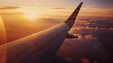 Obraz premium Distant Smoke from Wildfires Visible During Sunset Flight Over Clouds