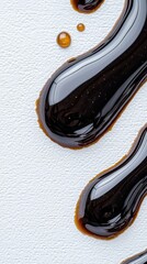 Close-up of rich dark chocolate texture mid-splash on light textured background showcasing glossy chocolate artistry in motion