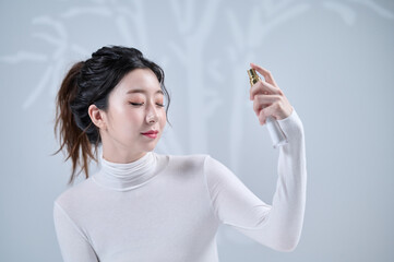 Woman Spritzing Face with Hydrating Spray
