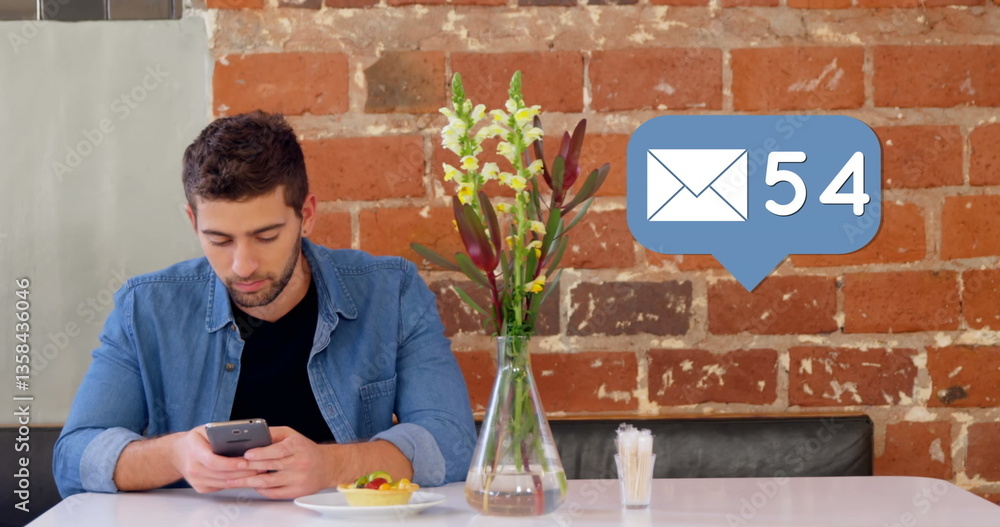 Aufkleber young man checking smartphone notifications while sitting at cafe table