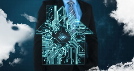 In suit, businessman using digital house circuit overlay for smart home technology