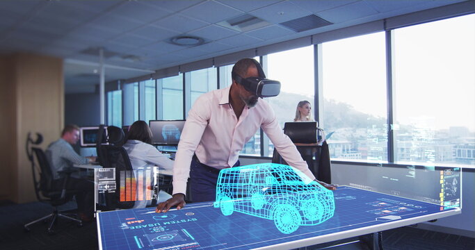 In modern office, man using VR headset interacting with 3D car model on screen - Powered by Adobe