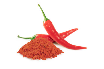 Pile of chili powder with red hot chili peppers isolated on white background.