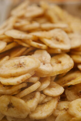 Crunchy dried banana slices in a food market setting