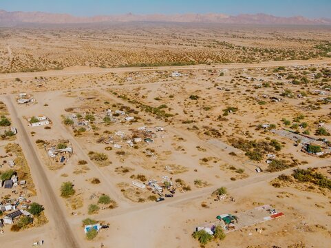 Aerial view of Slab City, California, USA, a squatter community in the Sonoran Desert. Residents live off-grid in RVs and makeshift homes, seeking freedom and alternative lifestyles.