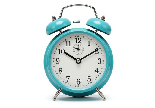 A turquoise alarm clock with bells and a white face on a white background in a studio shot