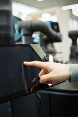 Naklejka premium Engaging with Modern Technology: Touchscreen Interaction in a Digital Environment