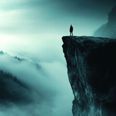 Solitary Figure on Misty Cliff Edge Contemplating Vast Expanse