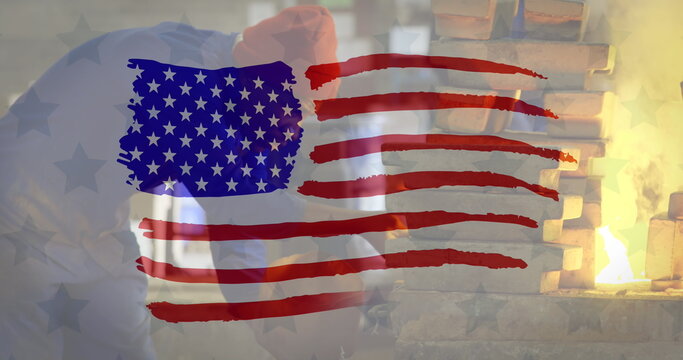 Image of drawn American flag over African American man working in factory in the background - Powered by Adobe