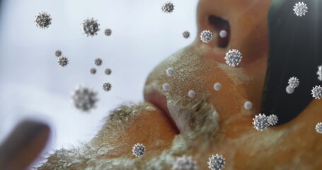 Image of cells spreading over close up of face of man being shaved by barber wearing surgical gloves