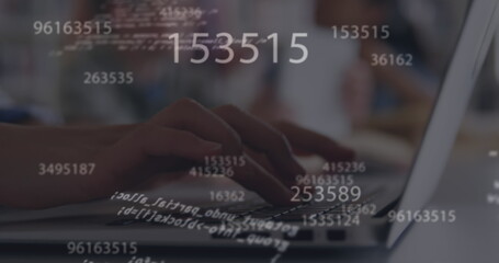 Digital image of multiple changing numbers and data processing against person using laptop