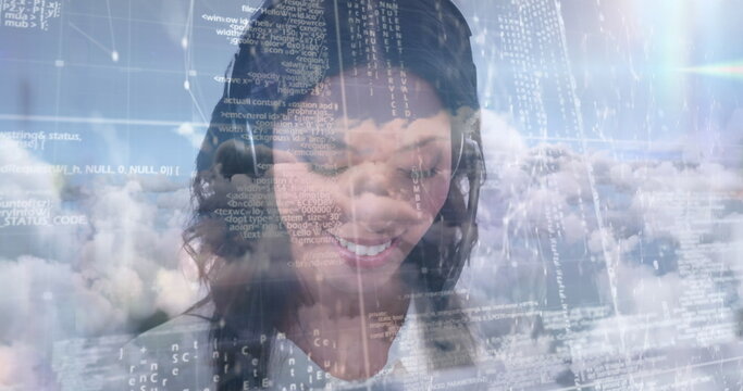 Image of businesswoman talking on phone headset with data processing against sky with clouds