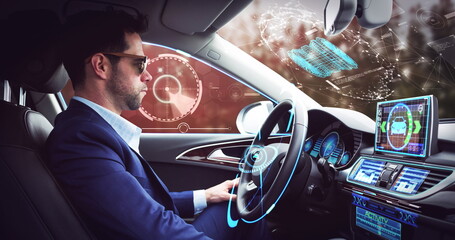 Image of digital interface over businessman in self-driving car