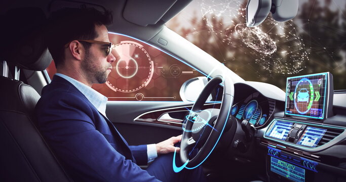 Image of digital interface over businessman in self-driving car - Powered by Adobe