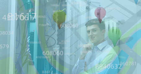 Image of numbers floating over caucasian man working in a server room