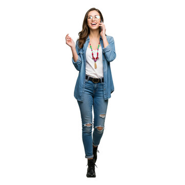 Trendy young woman walking and talking on phone