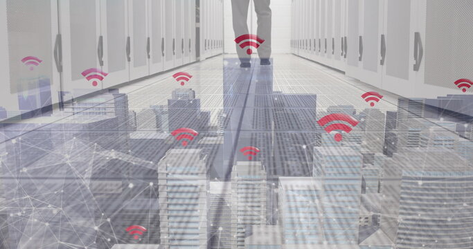 Image of skyscrapers with wifi symbols and caucasian man working in a server room - Powered by Adobe
