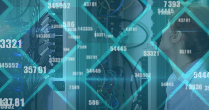 Image of floating changing numbers over caucasian woman working in server room