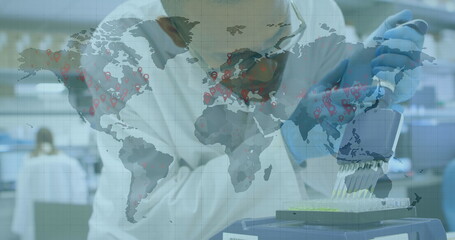 Image of world map with hands of scientist testing with equipment in lab