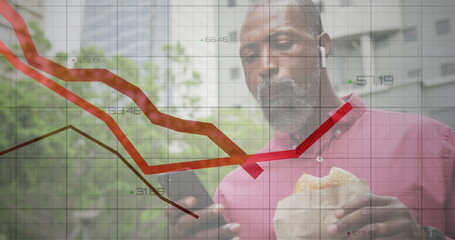 Financial data processing against african american man using smartphone and having a snack