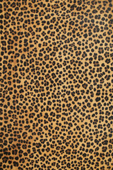 Gold and yellow metal texture with leopard print pattern on seamless fabric design