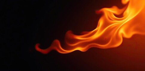Fototapeta premium Intense fire flames dancing against a dark black background, power, danger