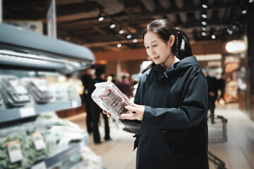 Woman Shopping for Fresh Produce in a Modern Supermarket