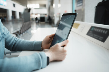 Engaging with Technology: A Traveler Using a Tablet in an Airport Setting
