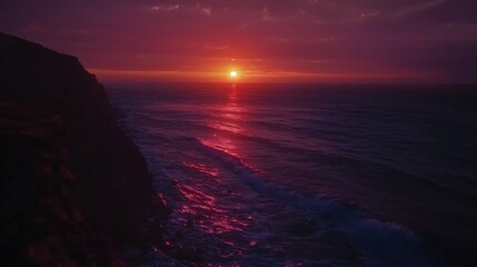 Serene Sunset Over Ocean Waves Reflecting Vivid Colors on a Tranquil Evening Sky at the Coastline