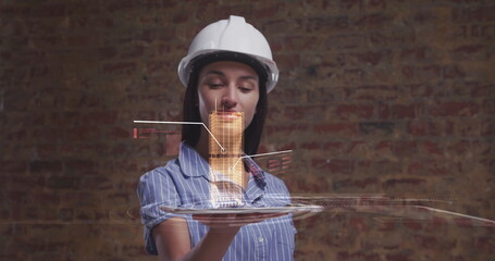 Image of 3d interactive model of city spinning over tablet held by female architect