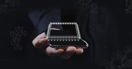 Image of digital model spinning over smartphone screen held by businessman