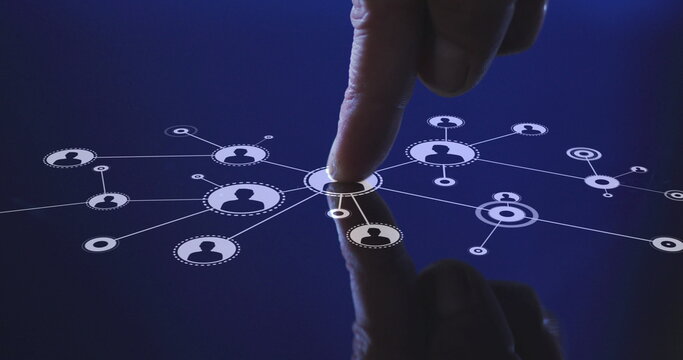Image of man's finger touching interactive screen with network of icons - Powered by Adobe