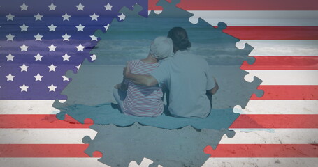 Image of american flag jigsaw puzzles revealing senior couple embracing on beach