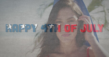 Image of happy 4th of july text with american flag pattern over woman with surfboard on beach