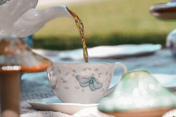 Floral Tea Set for a  Spring Tea Party - Pouring Black Tea