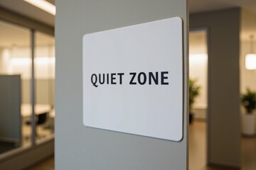 A Close-Up of a 'Quiet Zone' Sign in a Modern Office Environment, Indicating a Designated Space for Silence and Focused Work