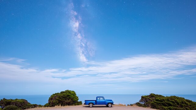 A vintage car parked on a hilltop overlooking the Milky Way, combining nostalgia with cosmic beauty and leaving room for ad copy,