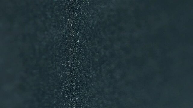 Dye mix. Paint grain texture. Black blue color gradient glitter sand particles surface art design with free space on abstract background.