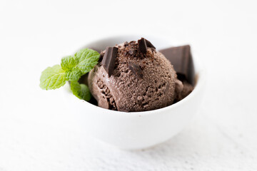 Chocolate ice cream with mint leaves.