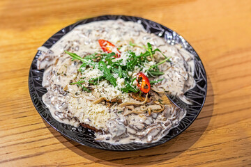 traditional ukrainian dish, draniki with mushroom cream sauce